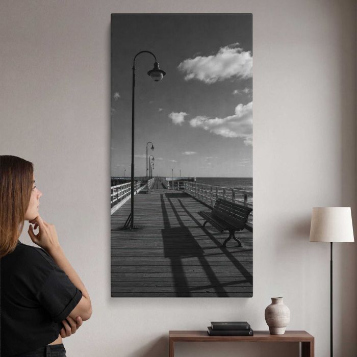 Black and white empty seaside pier with benches and lamps canvas print, interior display view