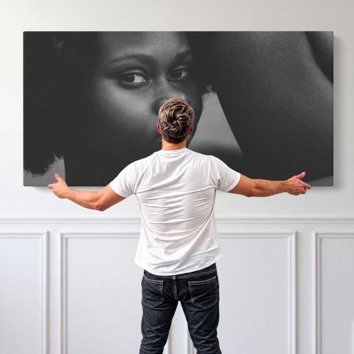 Black Woman in Monochrome canvas print, canvas shown with a person for scale
