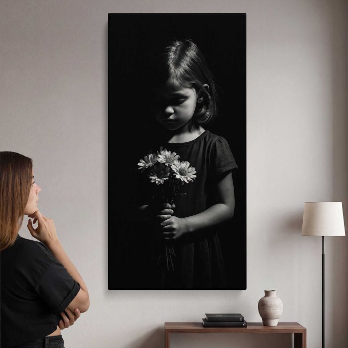Child holding flowers in darkness canvas print, interior display view