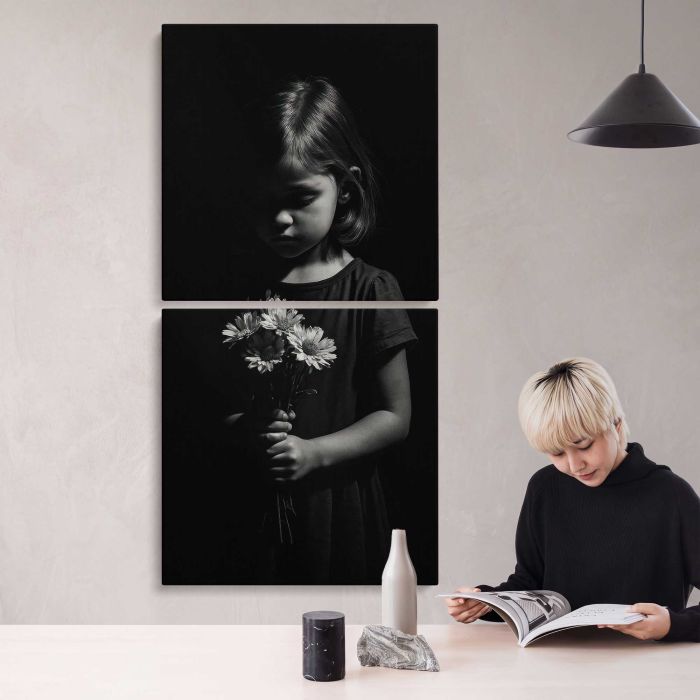 Child holding flowers in darkness canvas print, interior display view