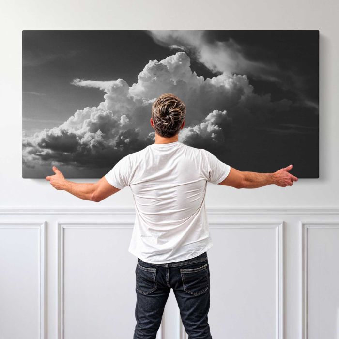 Clouds in Monochrome canvas print, canvas shown with a person for scale
