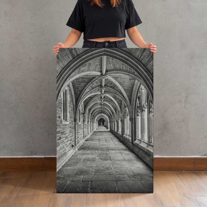 Corridor in Black and White canvas print, canvas shown with a person for scale