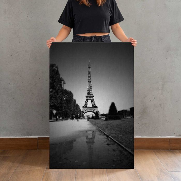 Eiffel Tower in Black and White canvas print, canvas shown with a person for scale
