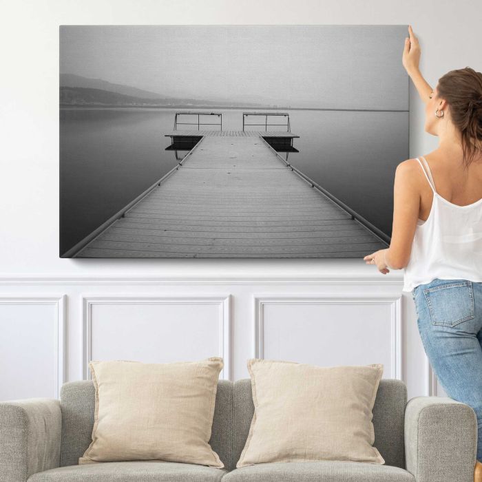 Grey Dock at a Quiet Lake canvas print, canvas shown with a person for scale