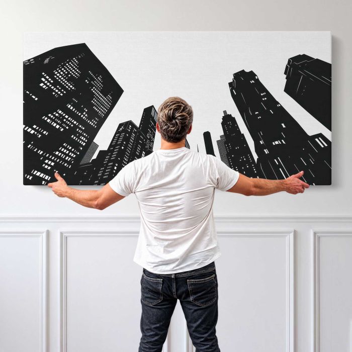 Monochrome City Skyline canvas print, canvas shown with a person for scale