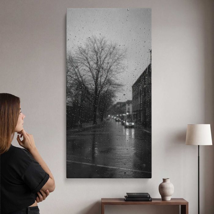 Rainy city street through window droplets, moody monochrome canvas print, interior display view