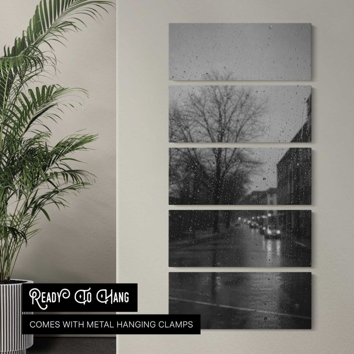 Rainy city street through window droplets, moody monochrome canvas print, interior display view