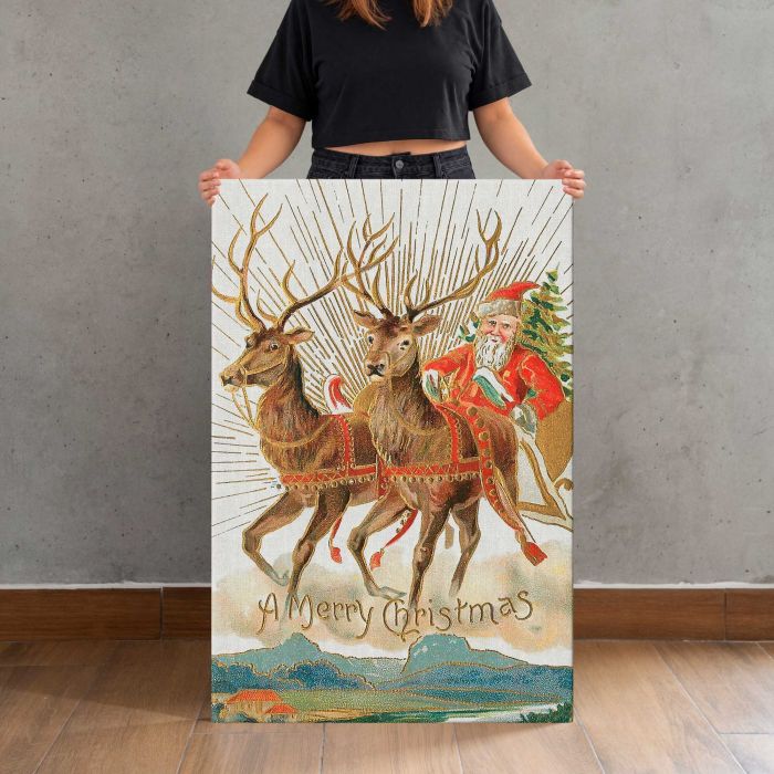 Santa Claus and His Reindeer (1907) by Souvenir Post Card Company canvas print, canvas shown with a person for scale