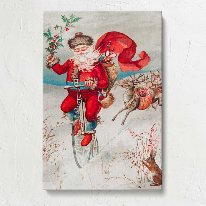 Santa Claus on a Penny Farthing with Reindeer and Rabbit canvas print, front canvas view