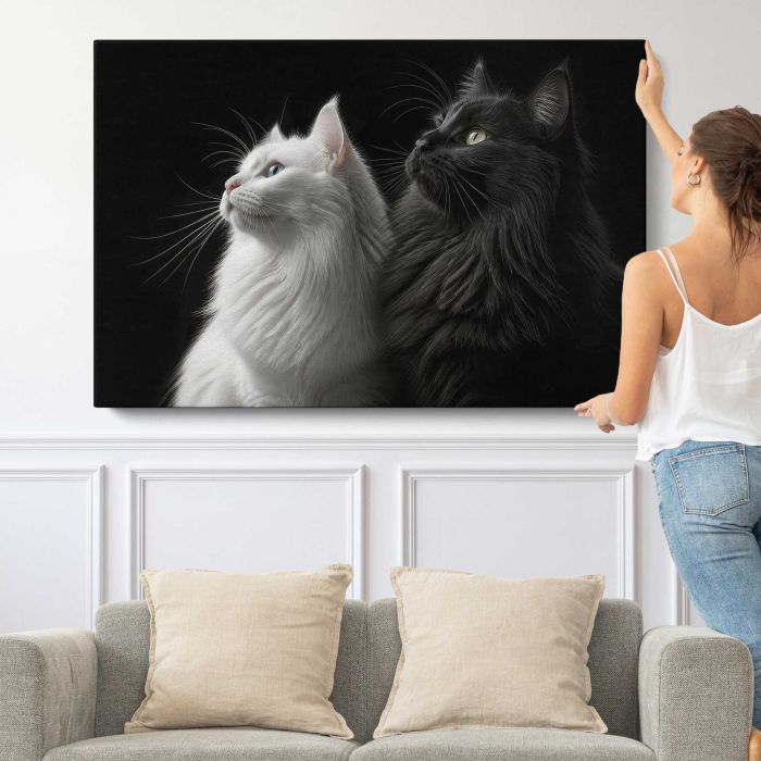 Two Cats in Black and White canvas print, canvas shown with a person for scale
