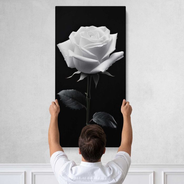 White Rose in Monochrome canvas print, tall canvas held against a wall