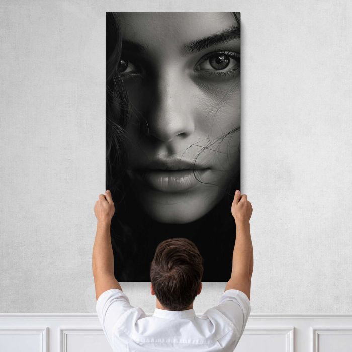 Woman’s Face in Monochrome canvas print, tall canvas held against a wall