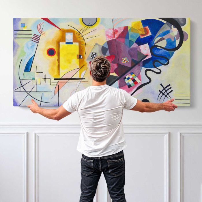 Yellow-Red-Blue by Wassily Kandinsky canvas print, canvas shown with a person for scale