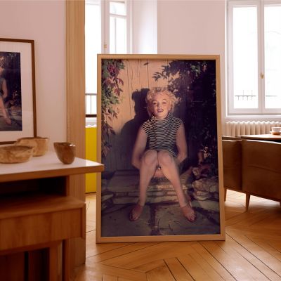 Marilyn Monroe Seated in Stripes - Serene Vintage Glamour Scene 