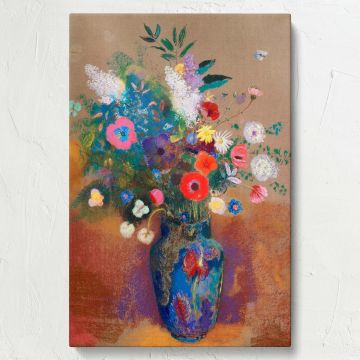 Odilon Redon's Bouquet of Flowers painting features vibrant blossoms in shades of red, blue, and white arranged in a striking blue vase, set against a textured warm background, with dreamlike pastel details creating an ethereal and timeless artwork.