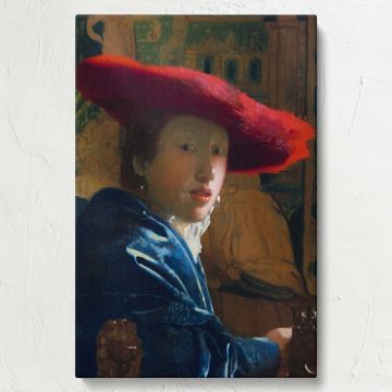 Elegant wall canvas of Johannes Vermeer's Girl with the Red Hat featuring a serene young woman in a striking red hat, with her expression softly lit by natural light, highlighting the detailed textures of her blue shawl and the golden background.