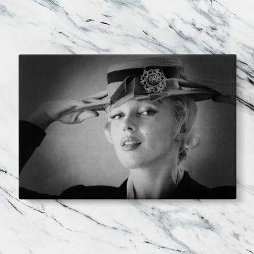 Marilyn Monroe Wearing a Hat canvas artwork displayed on a marble background