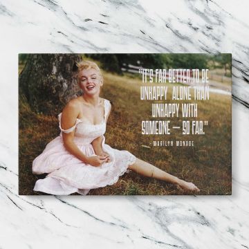 Marilyn Monroe in a Pink Dress with Quote canvas artwork displayed on a marble background