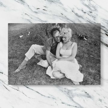 Marilyn Monroe and Arthur Miller Outdoors canvas artwork displayed on a marble background
