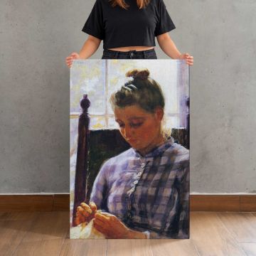 Girl Sewing beside a Window canvas print, held for scale