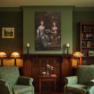 Historical canvas wall print of Henrietta and Mary Hyde by Willem Wissing, rendered in warm bronze and silver satin tones. The two girls are seated in a garden with roses and trees, with one girl extending her hand to hold a dove. The background of a soft