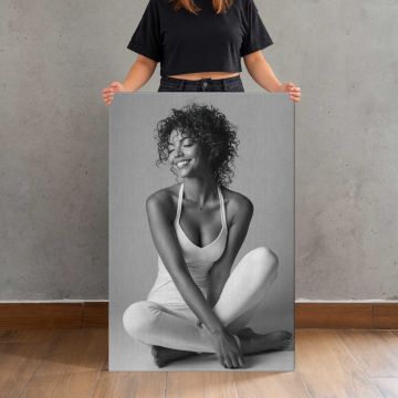 Joyful Woman in a Seated Pose canvas print, canvas shown with a person for scale
