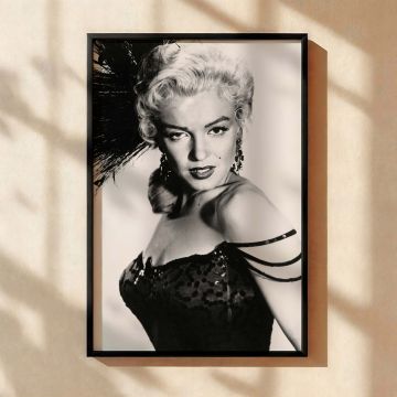 Glamorous vintage wall art of Marilyn Monroe wearing an iconic black feather headpiece and strappy gown perfect as a canvas wall art piece for retro interiors inspired by Hollywood's golden era and fans of glamour photo prints and bold fashion.