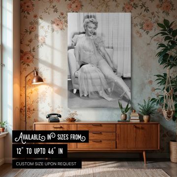 Iconic photo of Marilyn Monroe transformed into canvas wall art showing her seated in a chair wearing a sheer gown reflecting vintage Hollywood aesthetics and perfect for elegant woman decor lovers and collectors of timeless glamour prints.