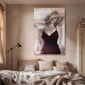 Vintage-style Marilyn Monroe photo featuring her in a black dress, iconic smile, and a detailed wicker chair background for boudoir room decor.