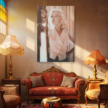 Marilyn Monroe captured in a calm and poised moment wearing a sleeveless white blouse framed in gentle light makes this image an iconic piece of Hollywood history ideal for vintage wall decor or photography collectors seeking timeless elegance.