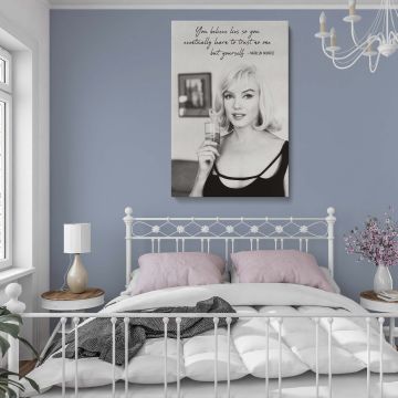 Marilyn Monroe holding a glass in a thoughtful moment with inspiring handwritten quote above her in this vintage Hollywood print perfect for fans of retro actress decor and motivational artwork with a timeless black and white aesthetic.
