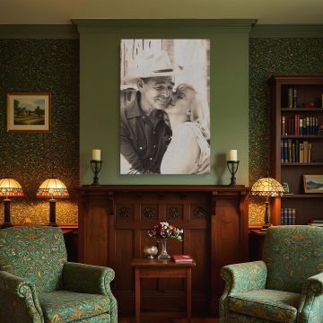 This Marilyn Monroe print captures a warm vintage moment with a man in a cowboy hat ideal for retro decor lovers and fans of emotional black and white photography it brings a touch of timeless romance and Hollywood history to any space.