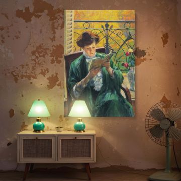 Yamashita Shintaro's "Woman Reading" presented as a canvas wall print captures a moment of introspective stillness. The woman reads in a warmly lit room adorned with floral details, elegant furnishings, and golden trees visible through a wrought iron balc