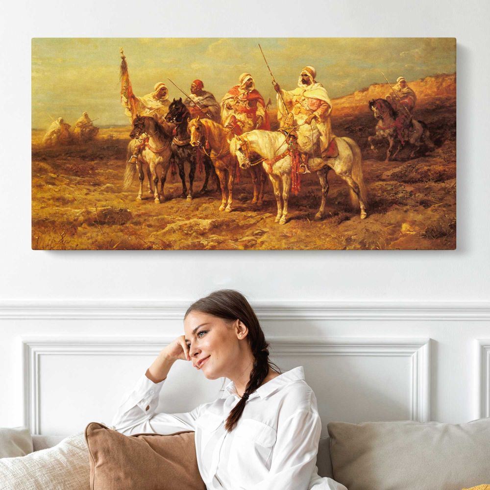 Arab Horsemen by a Watering Hole by Adolf Schreyer — single-panel canvas shown above a seated person