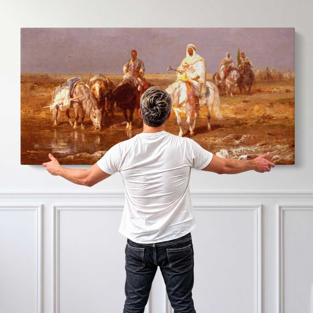 Arabs Watering Their Horses by Adolf Schreyer — single-panel canvas shown behind a standing person for scale