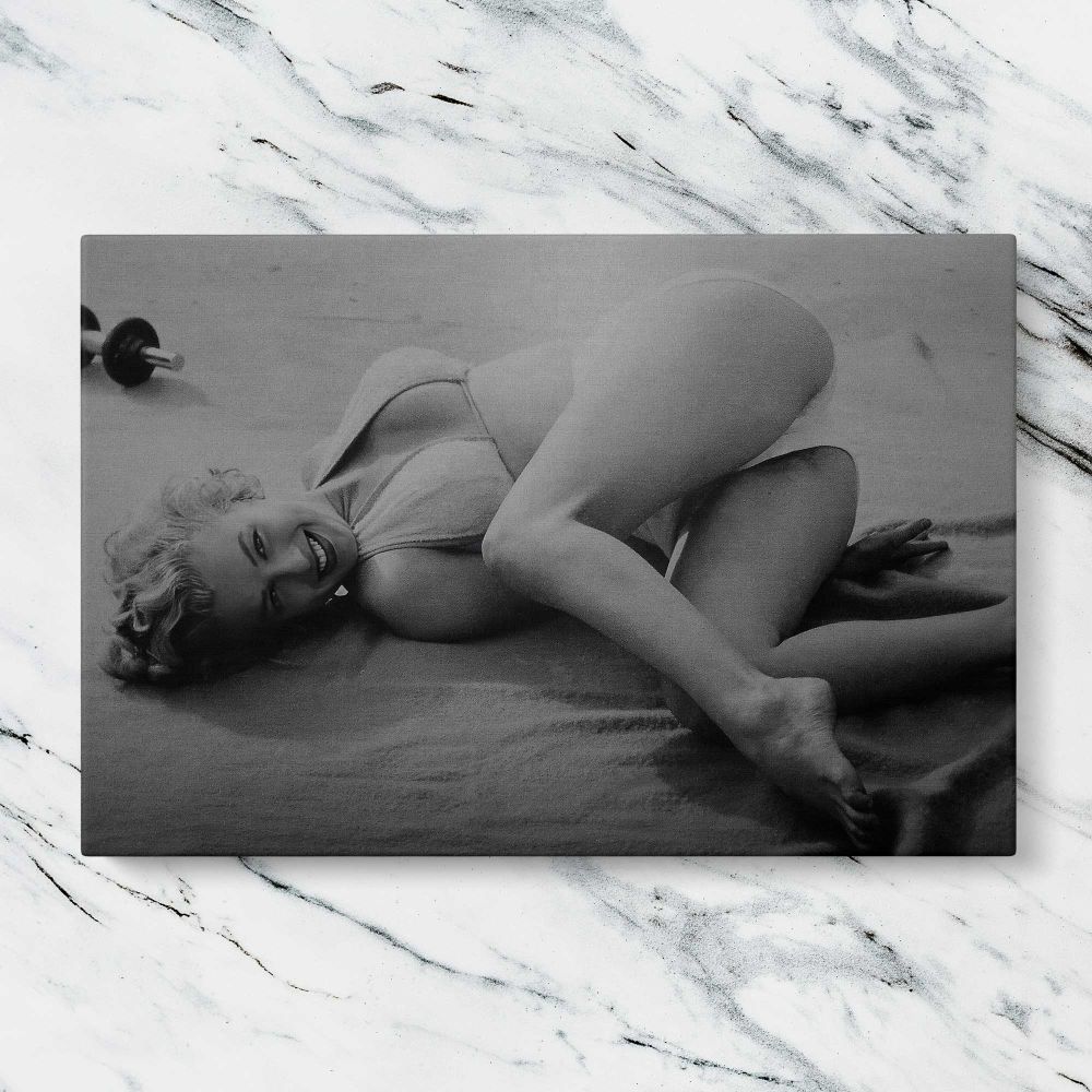 Marilyn Monroe Reclining Black and White Portrait canvas artwork displayed on a marble background