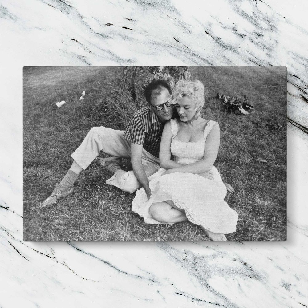Marilyn Monroe and Arthur Miller Outdoors canvas artwork displayed on a marble background