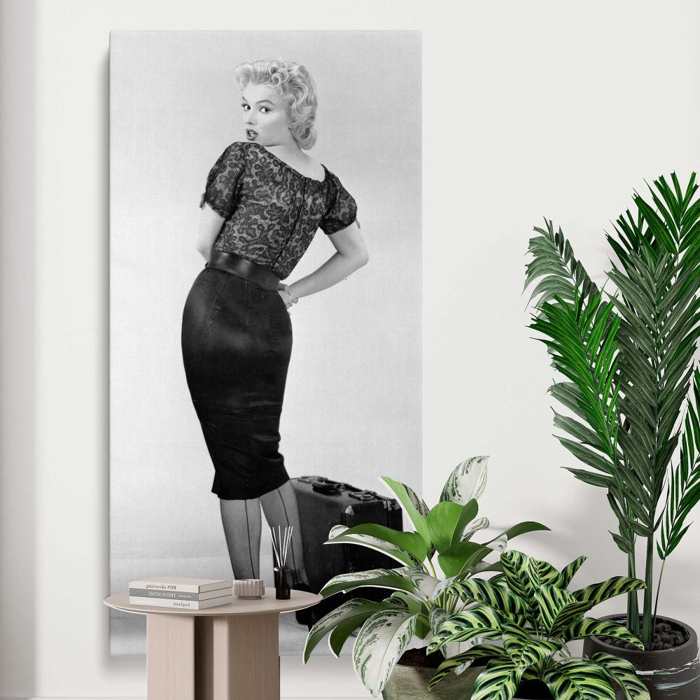 Marilyn Monroe Bus Stop Portrait with Suitcase canvas print displayed in a modern interior