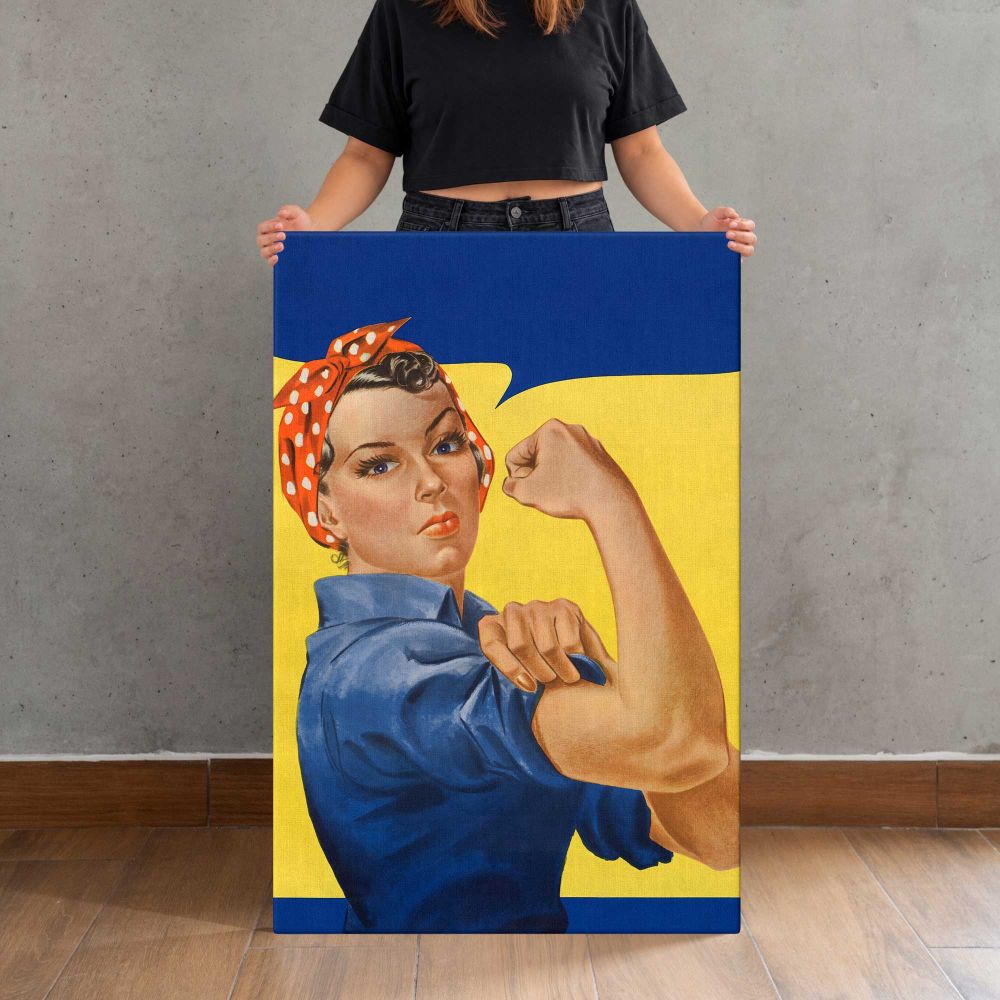 Woman Flexing in Blue Workwear canvas print, held for scale