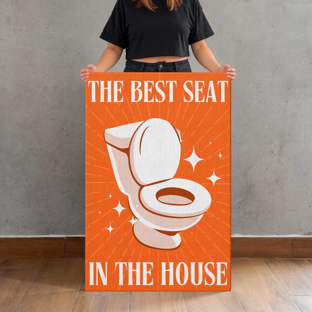 The Best Seat in the House Orange Bathroom Quote canvas print, held for scale