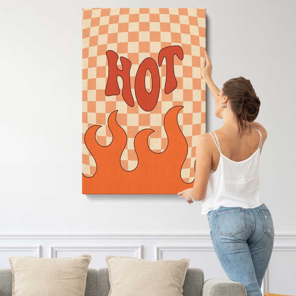 Hot Stuff Orange Checkerboard Typography canvas print, displayed on a wall