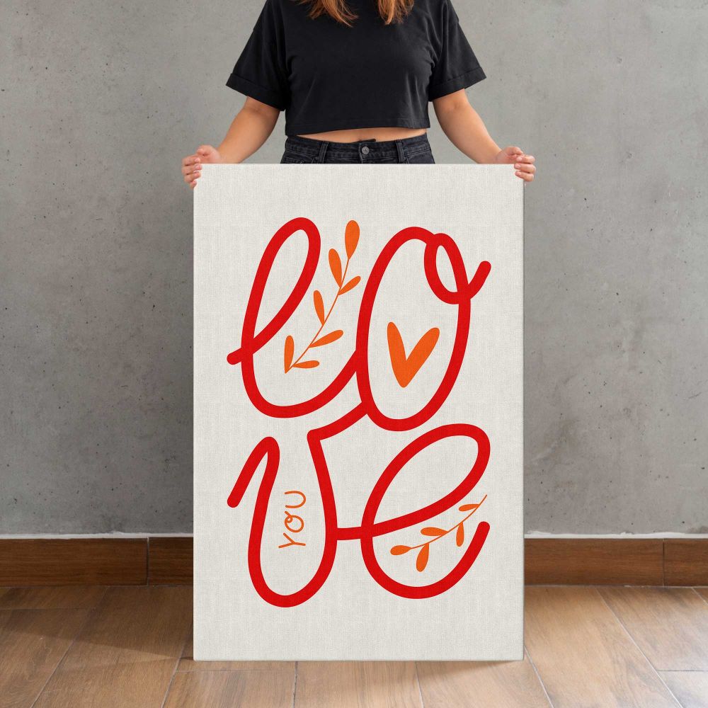 Red Love Script Typography canvas print, held for scale