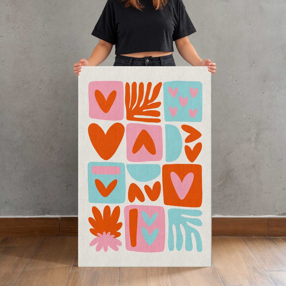Orange Pink and Turquoise Heart Collage canvas print, held for scale