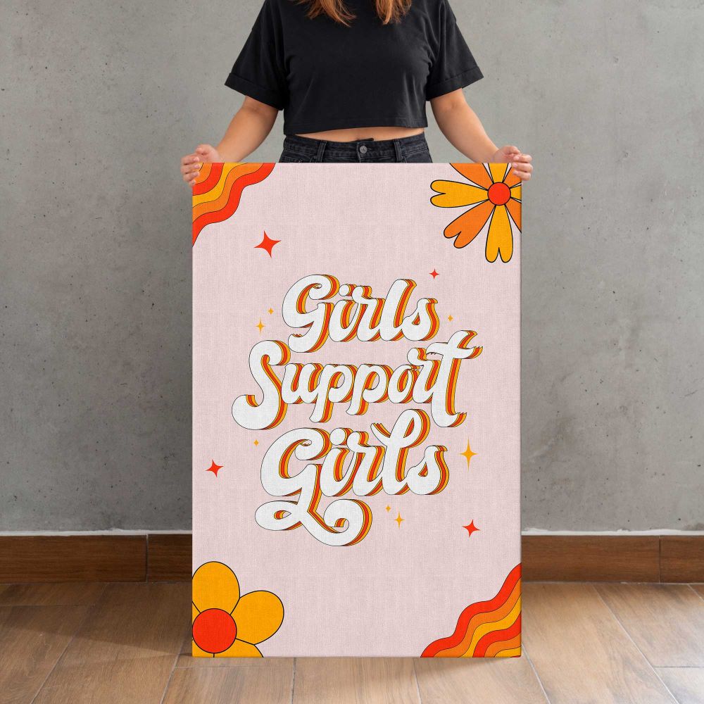Girls Support Girls Floral Typography canvas print, held for scale