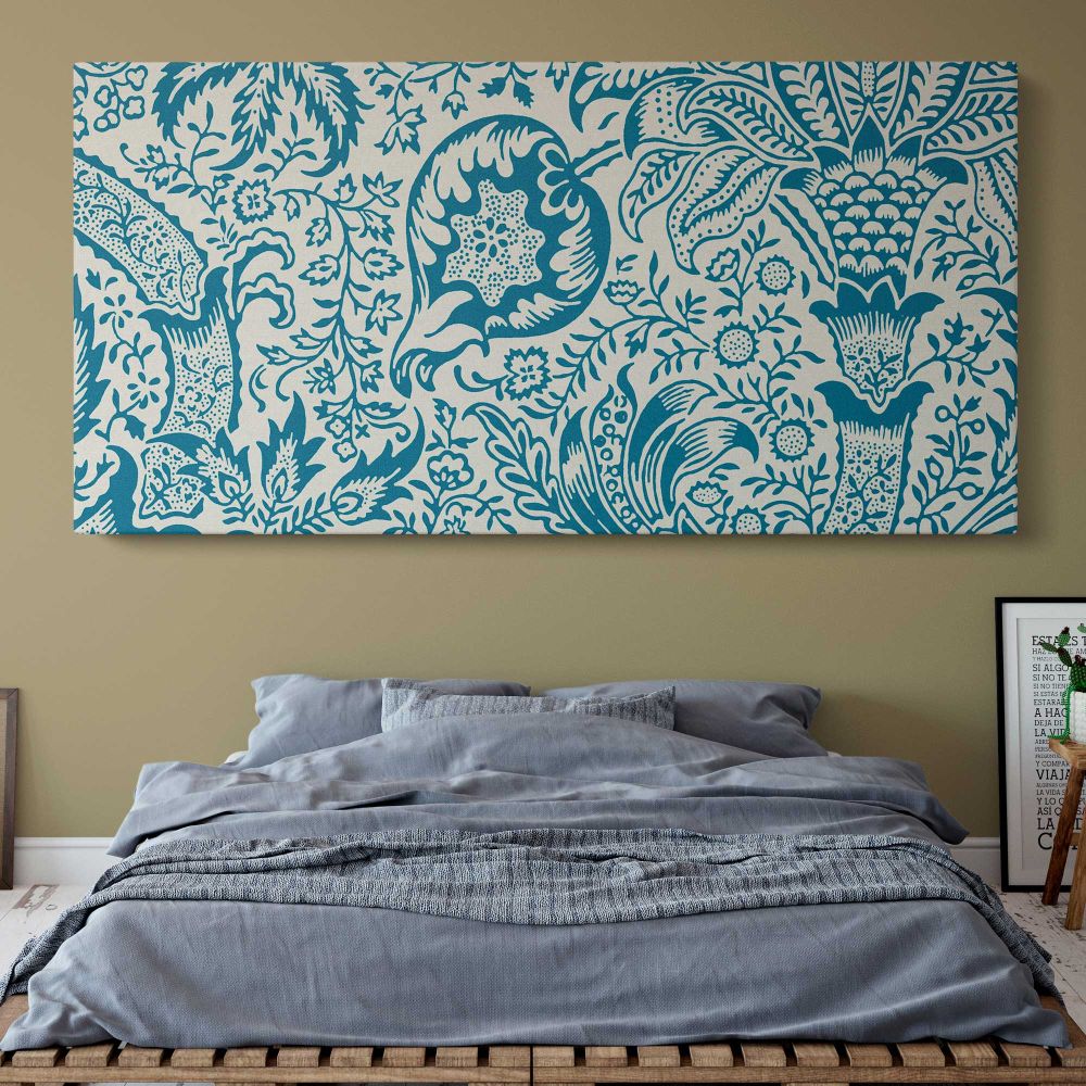 Indian Floral Pattern in Blue and Cream by William Morris — single-panel canvas above a bed with blue bedding