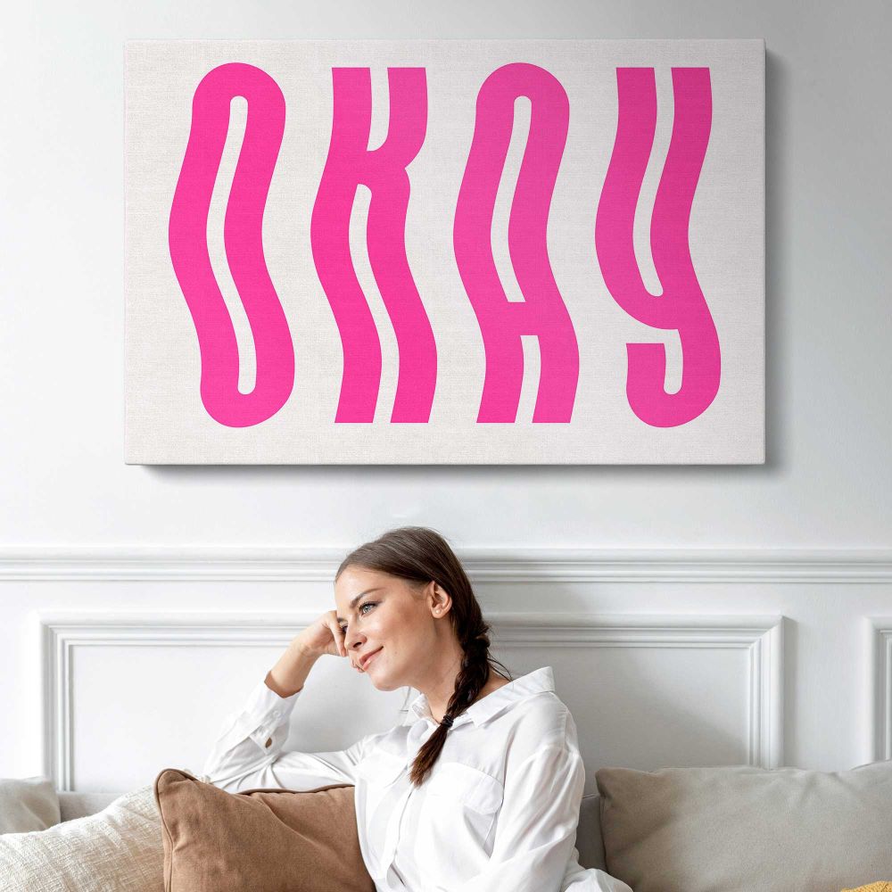 Okay Pink Typography - single-panel canvas displayed above a sofa