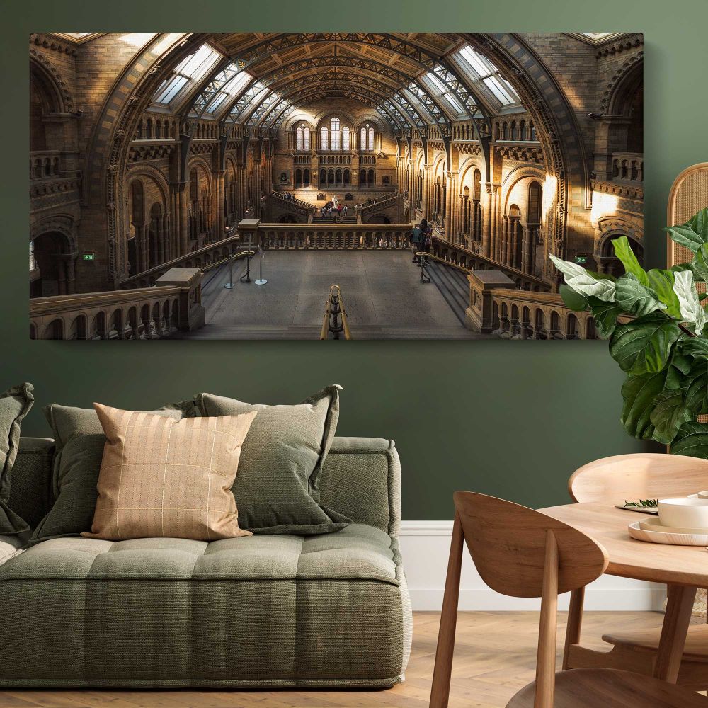 Sunlit Hall at the Natural History Museum — single-panel canvas above a green sofa