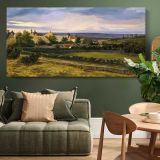 A Village in a Valley — single-panel canvas above a green sofa