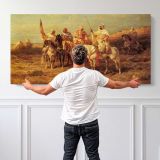 Arab Horsemen by a Watering Hole by Adolf Schreyer — single-panel canvas shown behind a standing person for scale