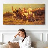 Arab Horsemen by a Watering Hole by Adolf Schreyer — single-panel canvas shown above a seated person